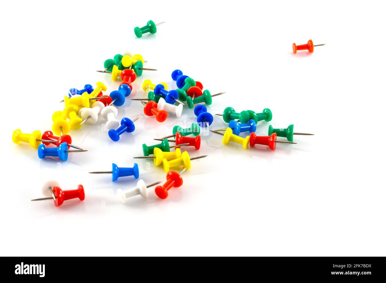 colorful push pins on white background Stock Photo - Alamy