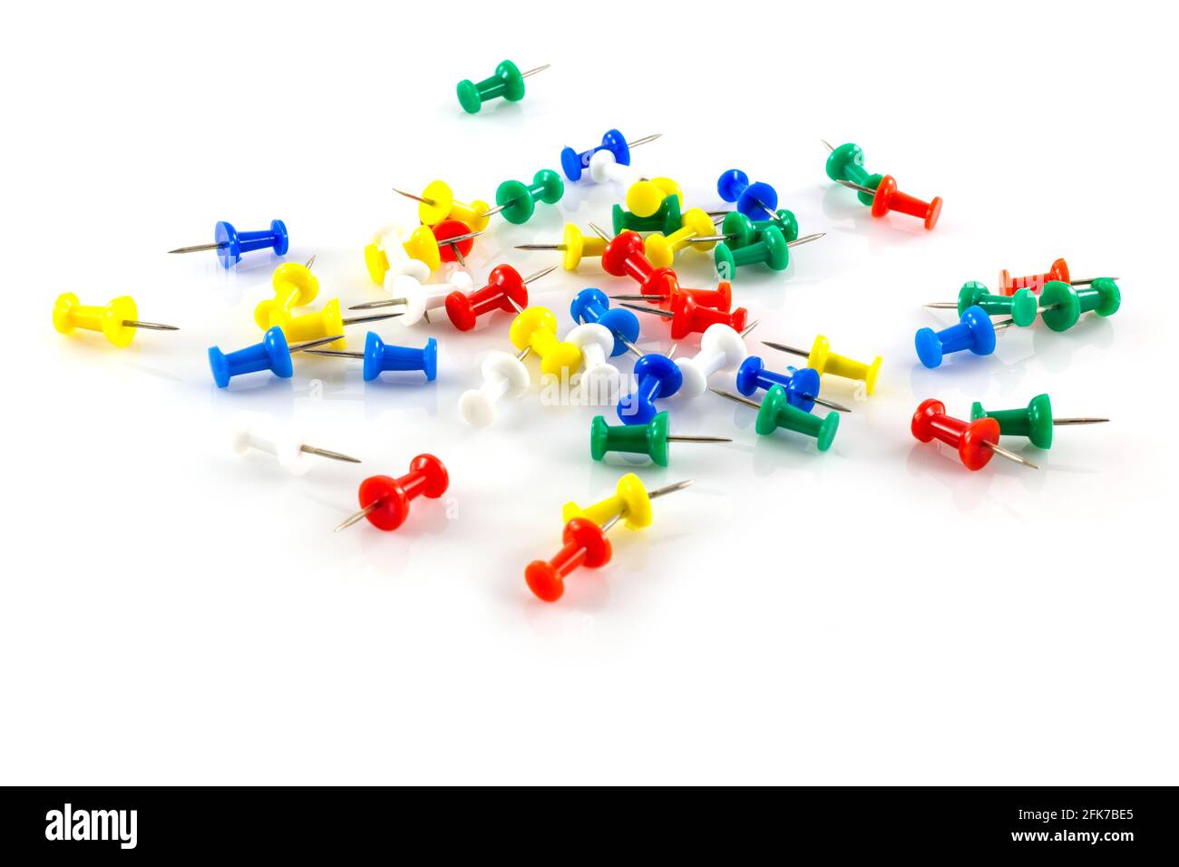 colorful push pins on white background Stock Photo - Alamy