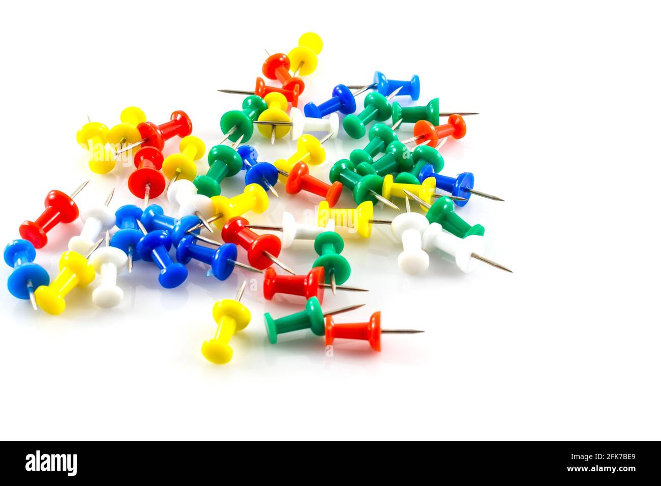 colorful push pins on white background Stock Photo - Alamy