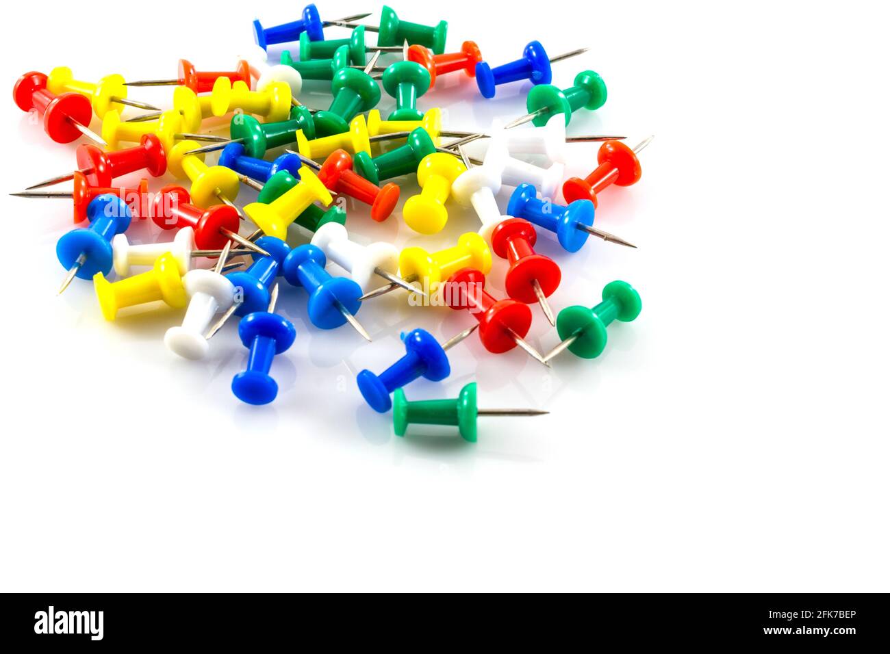 colorful push pins on white background Stock Photo - Alamy