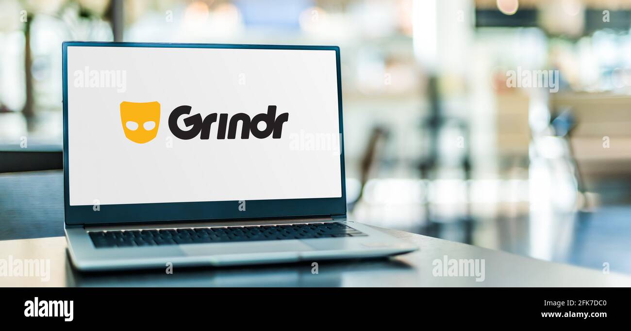 POZNAN, POL - APR 15, 2021: Laptop computer displaying logo of Grindr, a location-based social networking and online dating application for gay, bi, t Stock Photo