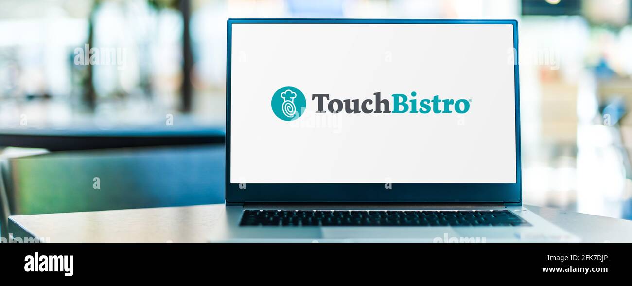 POZNAN, POL - MAR 15, 2021: Laptop computer displaying logo of TouchBistro, a software company that develops a restaurant point of sale system for the Stock Photo