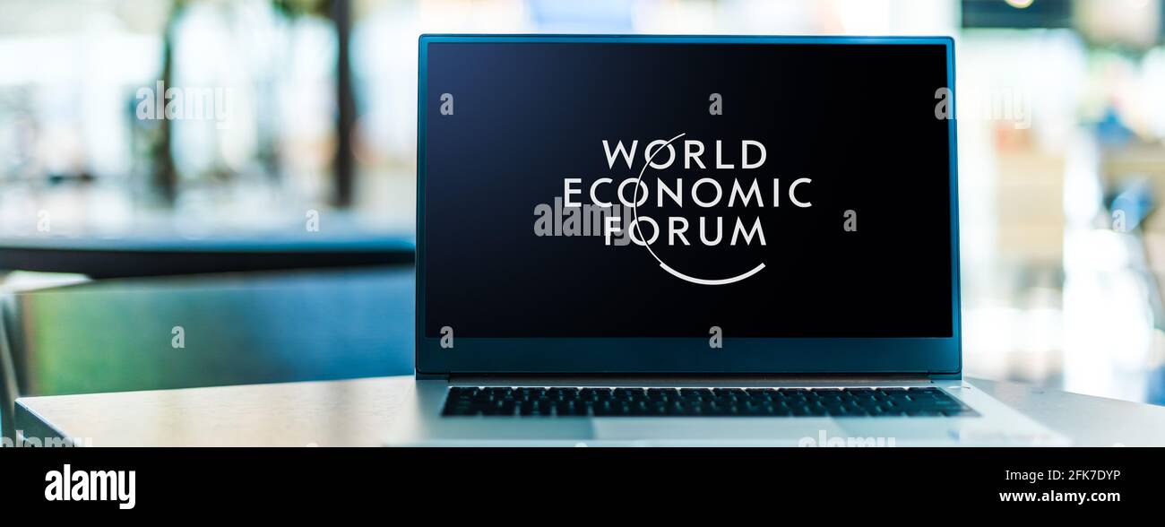 POZNAN, POL - APR 15, 2021: Laptop computer displaying logo of The World Economic Forum, an international NGO based in Cologny, Geneva Canton, Switzer Stock Photo