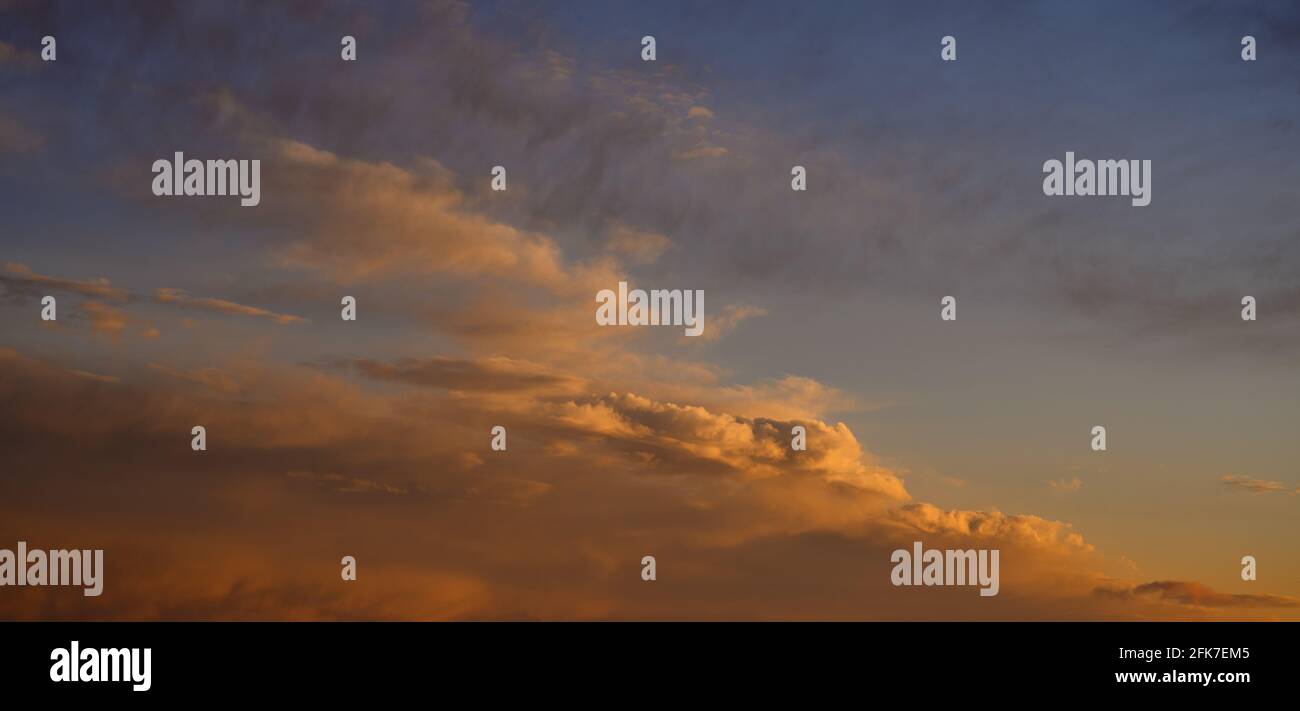 Beautiful colorful sunset sky with clouds and sunlight Stock Photo - Alamy