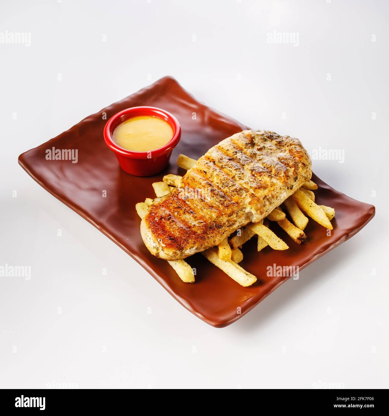 Chicken steak with french fries with honeymustard sauce Stock Photo Alamy