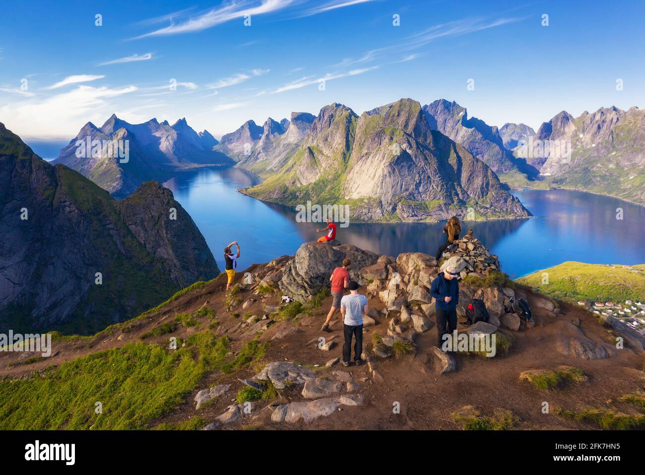 Hikers on top of Mt. Reinebringen, Lofoten islands, Norway Stock Photo