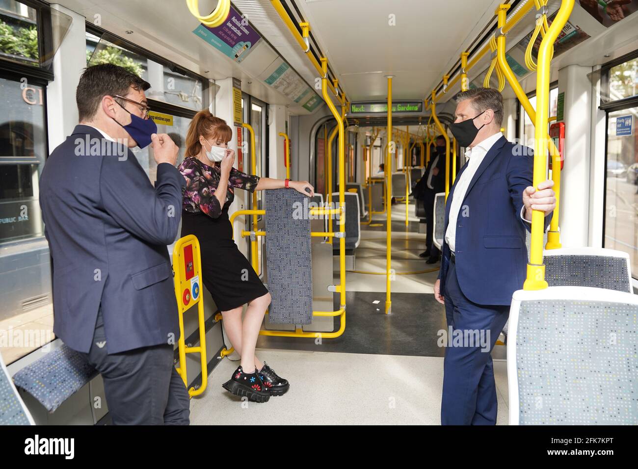 Labour leader Keir Starmer with Labour's Metro Mayor Andy Burnham and deputy leader of the Labour Party Angela Rayner, travel on a Metrolink tram, during a visit to Manchester. Picture date: Thursday April 29, 2021. Stock Photo