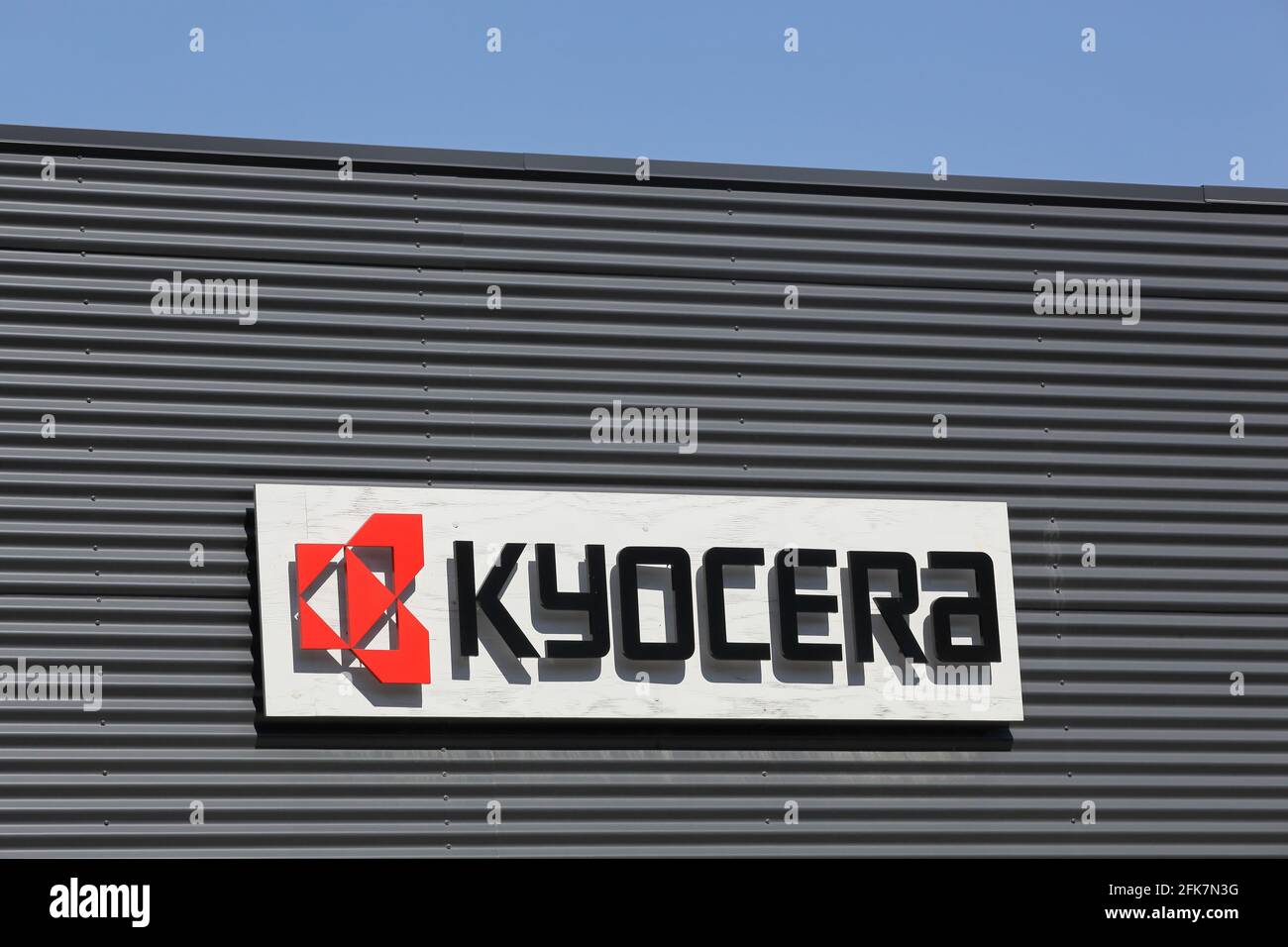 Svendborg, Denmark - August 13, 2020: Kyocera logo on a wall. Kyocera Corporation is a Japanese multinational ceramics and electronics manufacturer Stock Photo