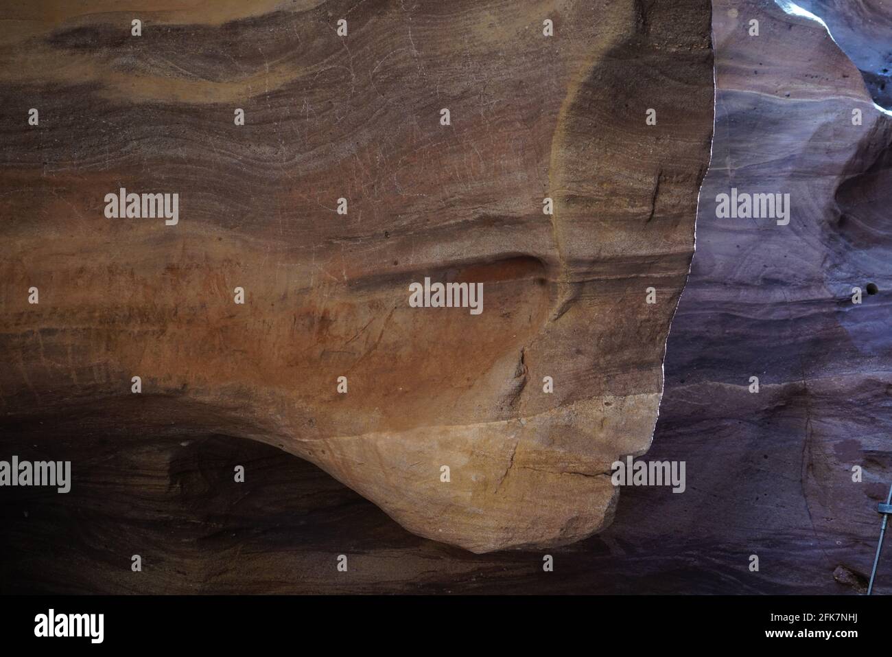 Human face can be viewed in eroded rock Pareidolia is the tendency for incorrect perception of a stimulus as an object, pattern or meaning known to th Stock Photo