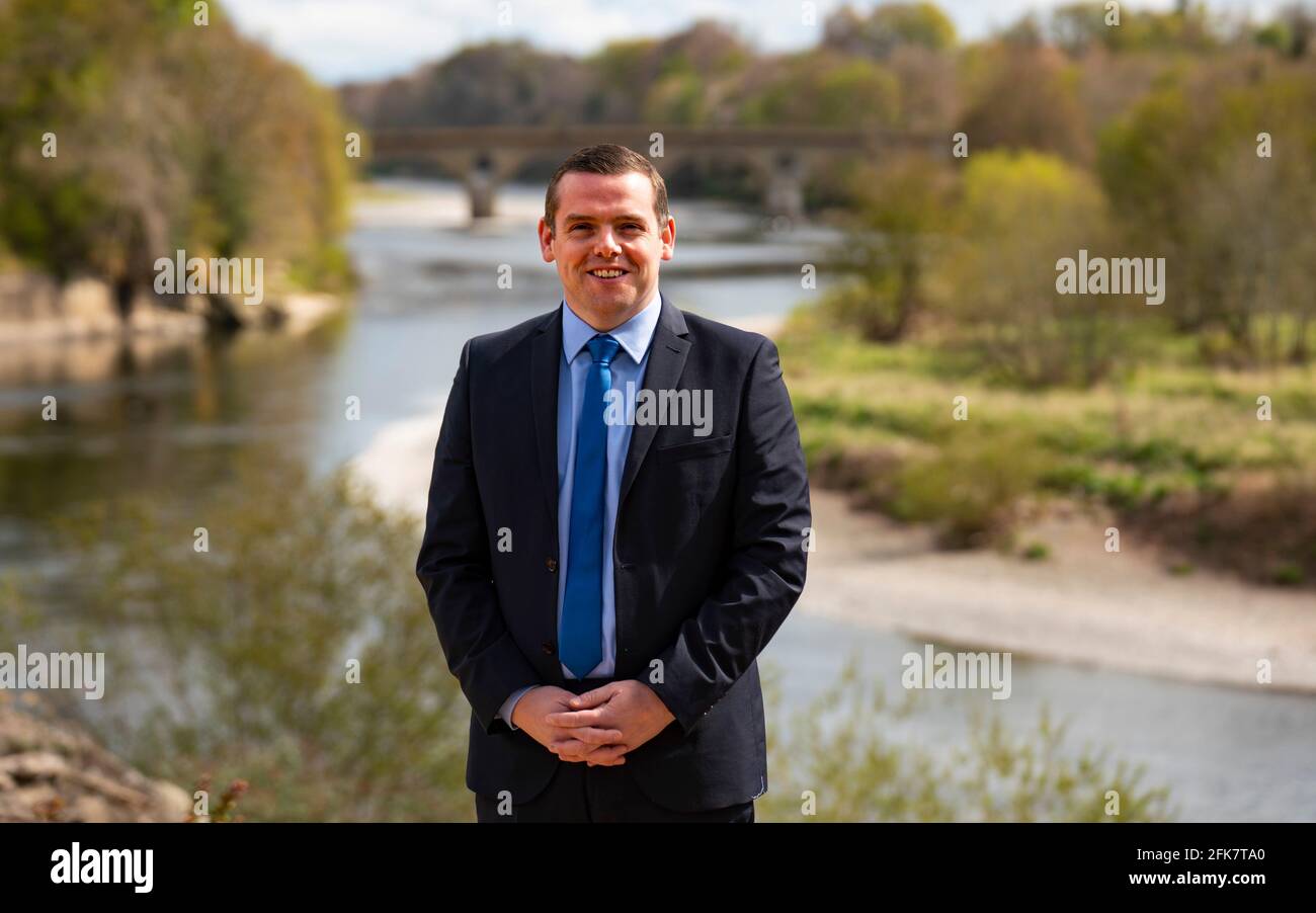 Coldstream, Scotland, UK. 29 April 2021. Douglas Ross, leader of the Scottish Conservative party makes speech in Coldstream in the Scottish Borders calling on pro-UK voters to use their peach party list votes to save Scotland’s recovery and stop another referendum.  Pic; Douglas Ross meets supports and the media at Henderson Park in Coldstream which stands on the Scottish-English border.  Iain Masterton/Alamy Live News Stock Photo