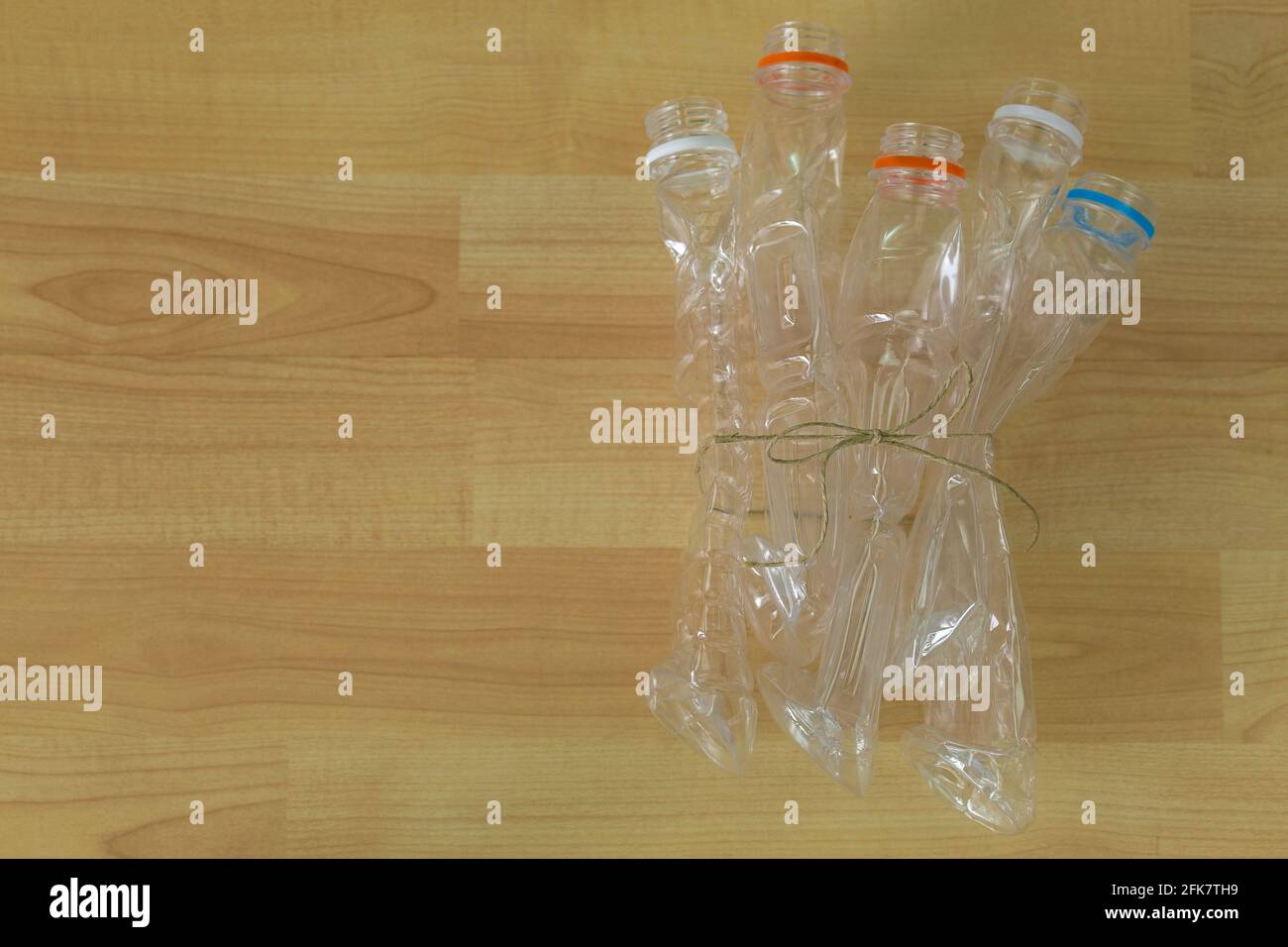 Group of emptied recyclable clear plastic mineral soda water bottles