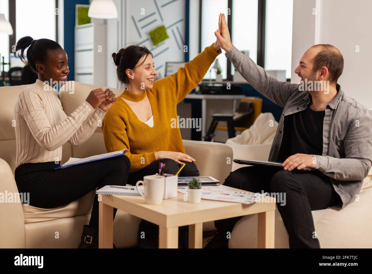 Diverse group people high five hi-res stock photography and images - Alamy
