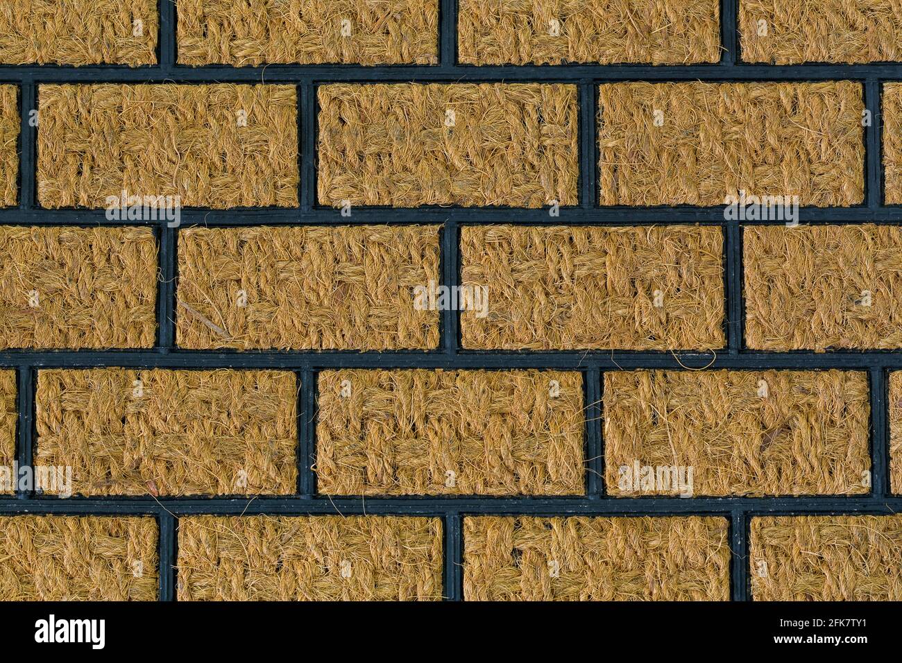 Outdoor shoe scraper, doormat made of coconut fiber. Closeup texture of ...