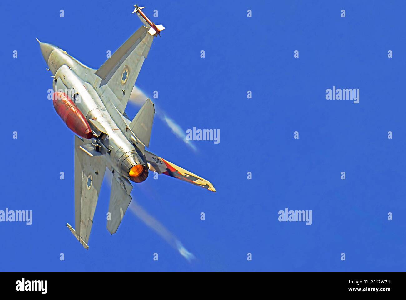 Israeli Air Force (IAF) General Dynamics F-16 in flight with a blue sky background. Stock Photo
