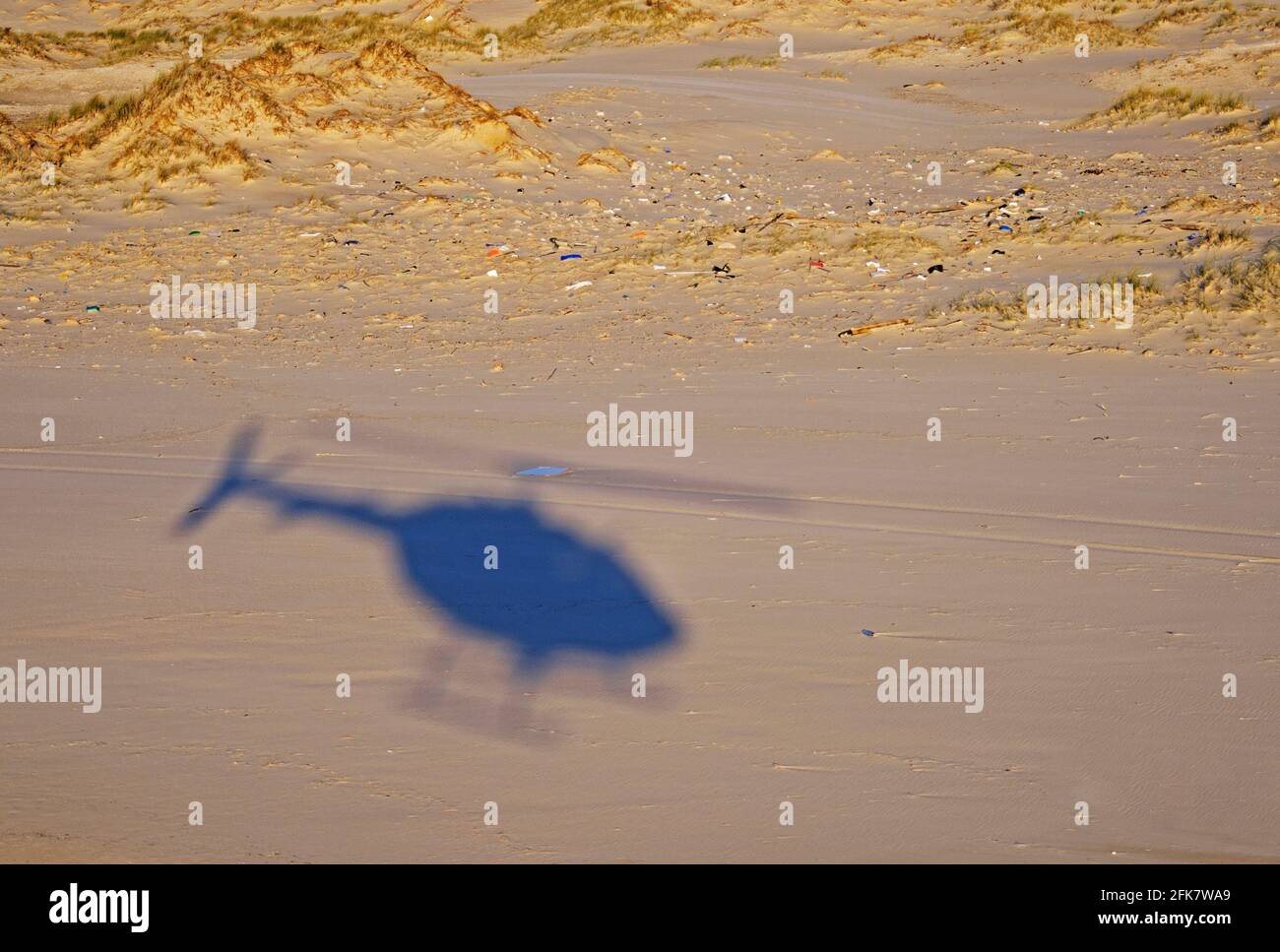 Shadow of an IAF helicopter silhouetted on the ground Stock Photo
