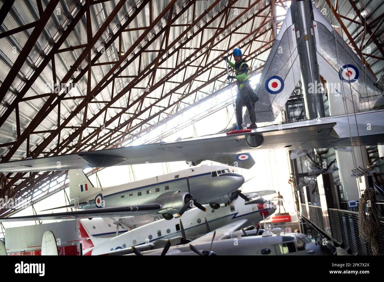 Specialist operators at the Royal Air Force Museum Cosford, near Telford, Shropshire, clean the Avro Vulcan aircraft displayed within the museum's National Cold War Exhibition, during annual high-level aircraft cleaning and maintenance. Picture date: Thursday April 29, 2021. Stock Photo