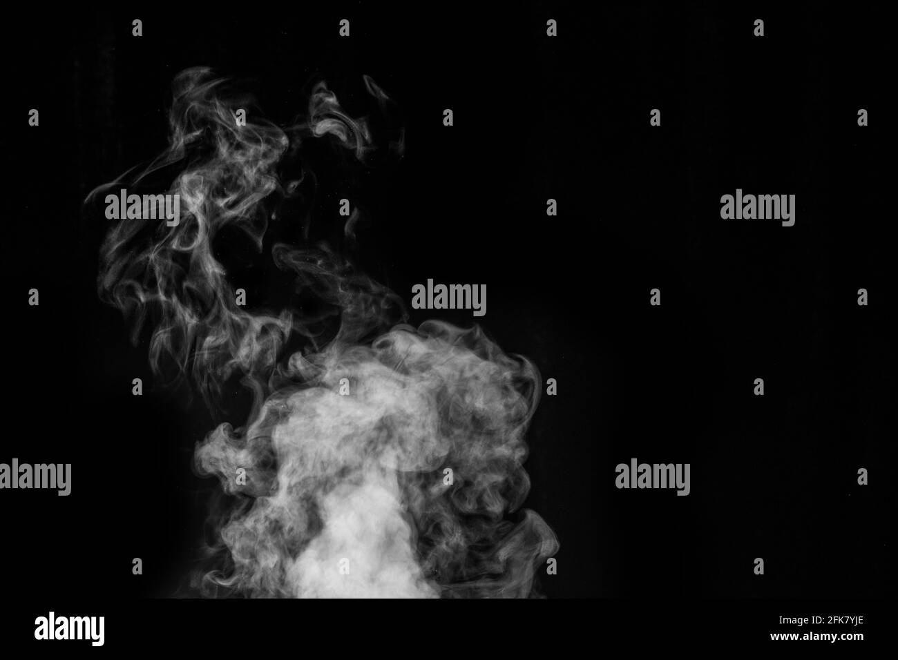 Figured smoke in the form of a mystical creature in the form of a ghost on a dark background. Abstract background, design element, for overlay on pict Stock Photo