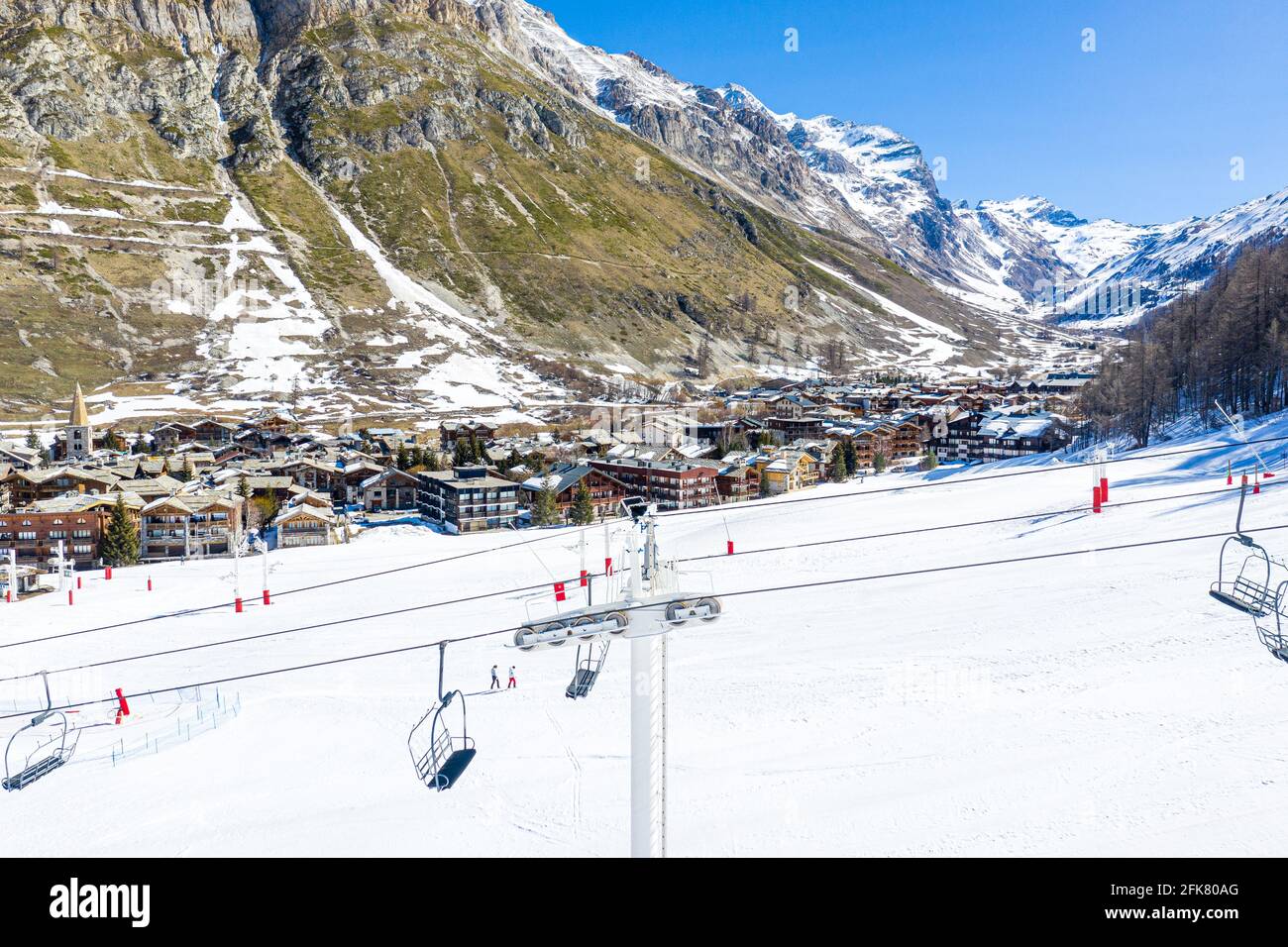 Ski Lift, Ski Resort and a small town in the valley of Alps in Val