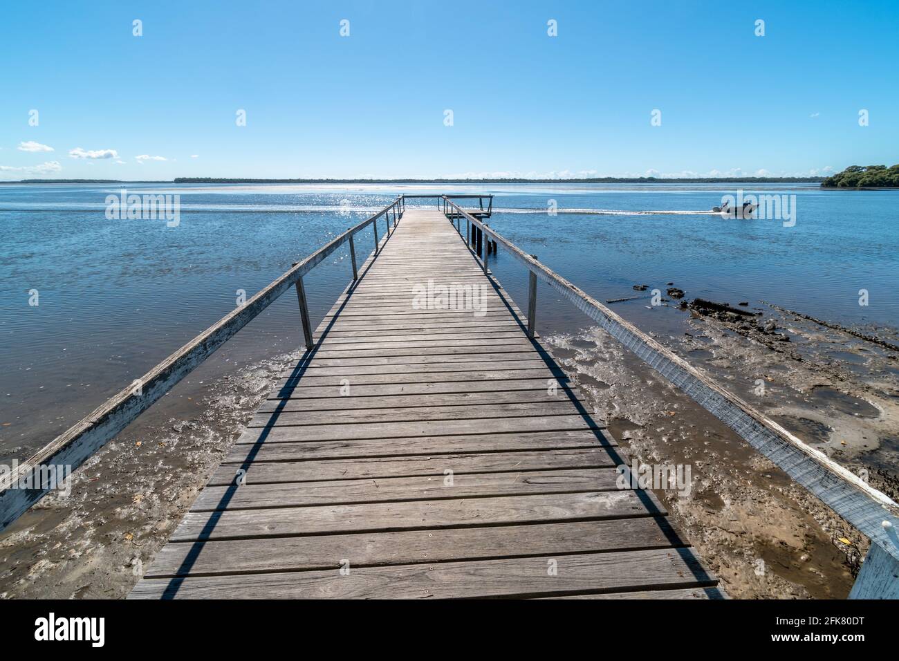 Looking over a pier and a boat hires stock photography and images Alamy