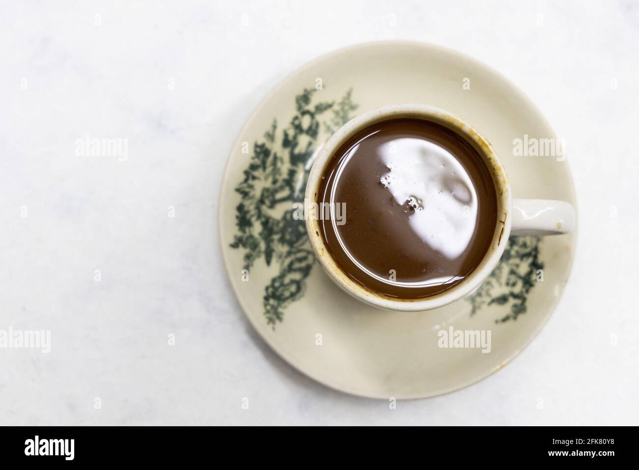 Overhead view on serving of classic retro cup of coffee at kopitiam or old coffee shop Stock Photo