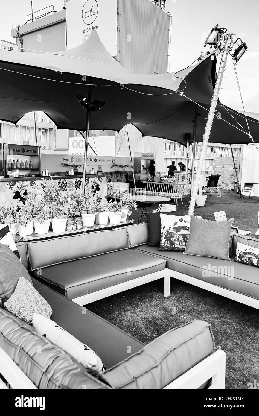 JOHANNESBURG, SOUTH AFRICA - Mar 13, 2021: Johannesburg, South Africa - October 11 2018: Outdoor beer garden cocktail lounge with comfy couches Stock Photo