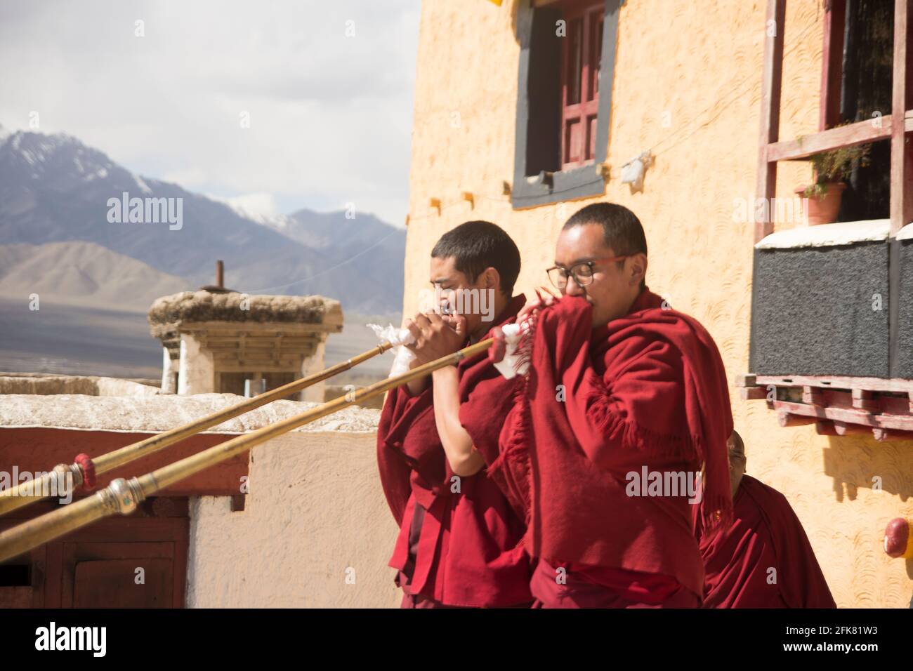 buddhist monks playing the tibetan horns in Tikshey monastery in Ladakh, India Stock Photo
