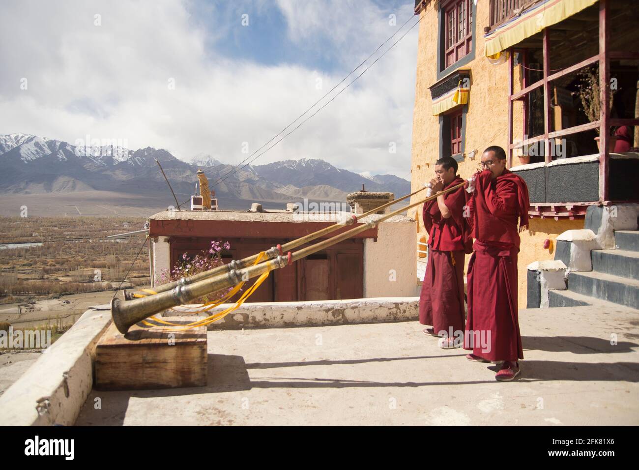 buddhist monks playing the tibetan horns in Tikshey monastery in Ladakh, India Stock Photo
