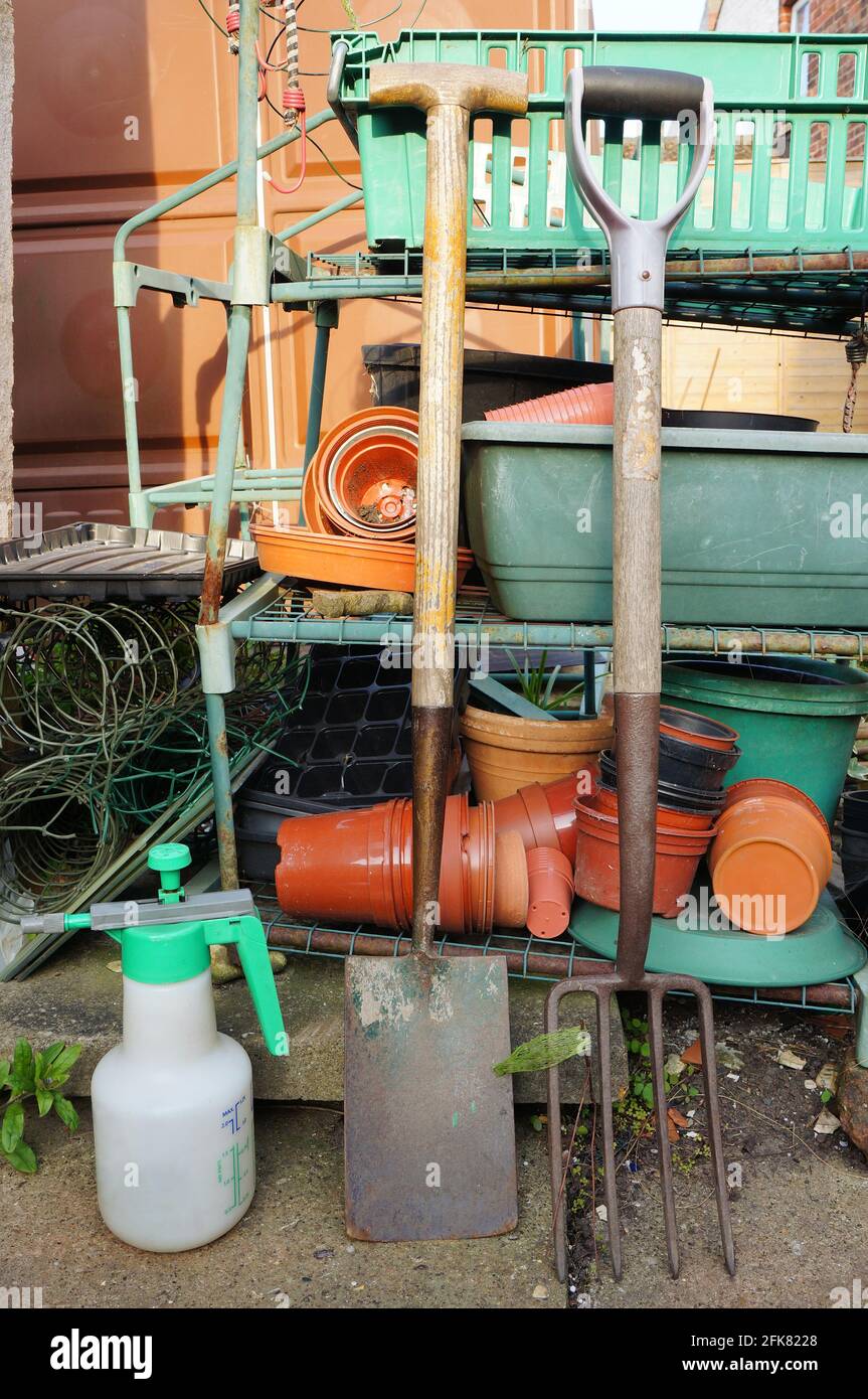 Plant pots & gardening tools in the backyard Stock Photo