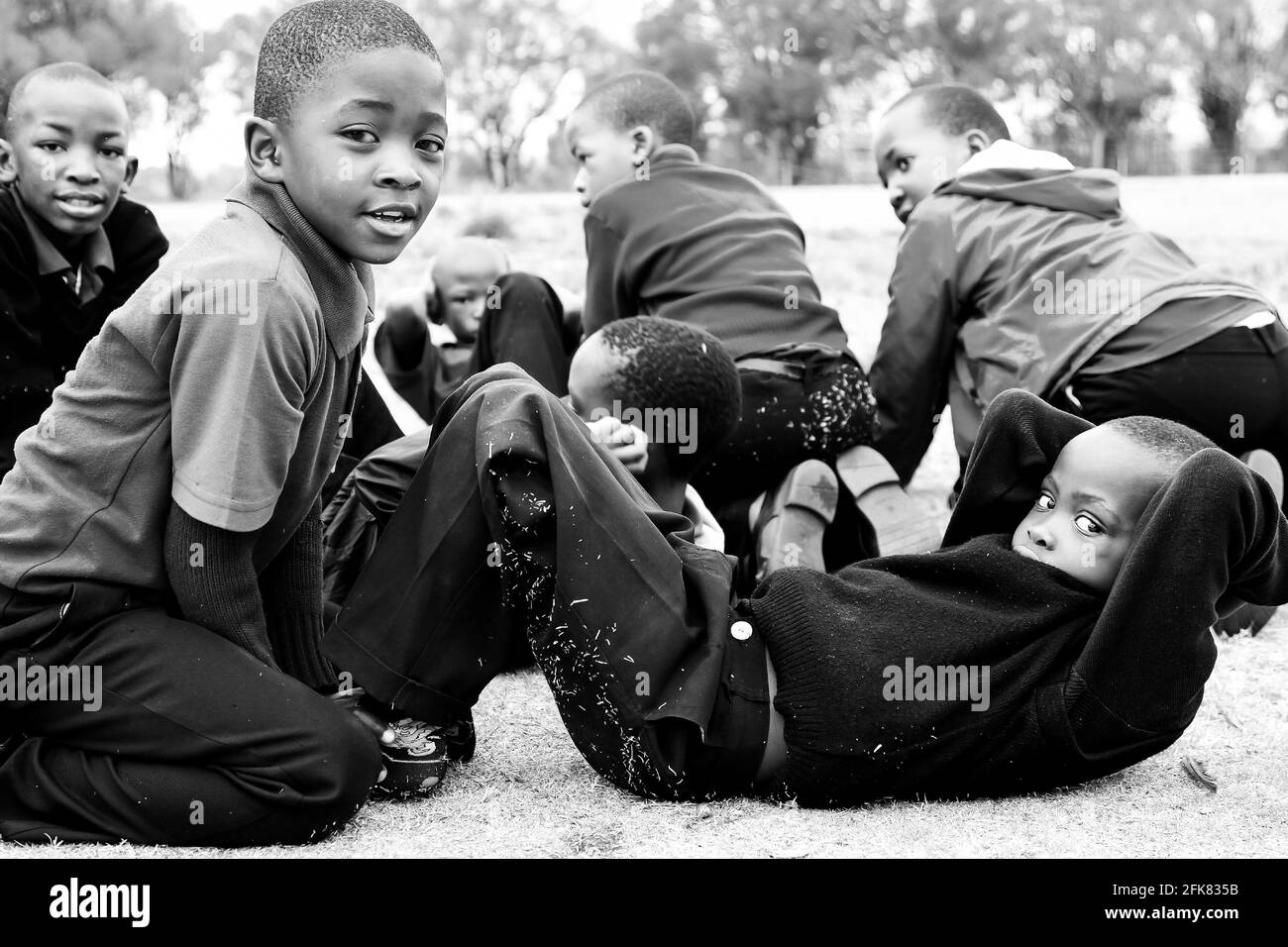 JOHANNESBURG, SOUTH AFRICA - Mar 13, 2021: Johannesburg, South Africa - October 14 2010: Diverse African Primary School children doing physical exerci Stock Photo