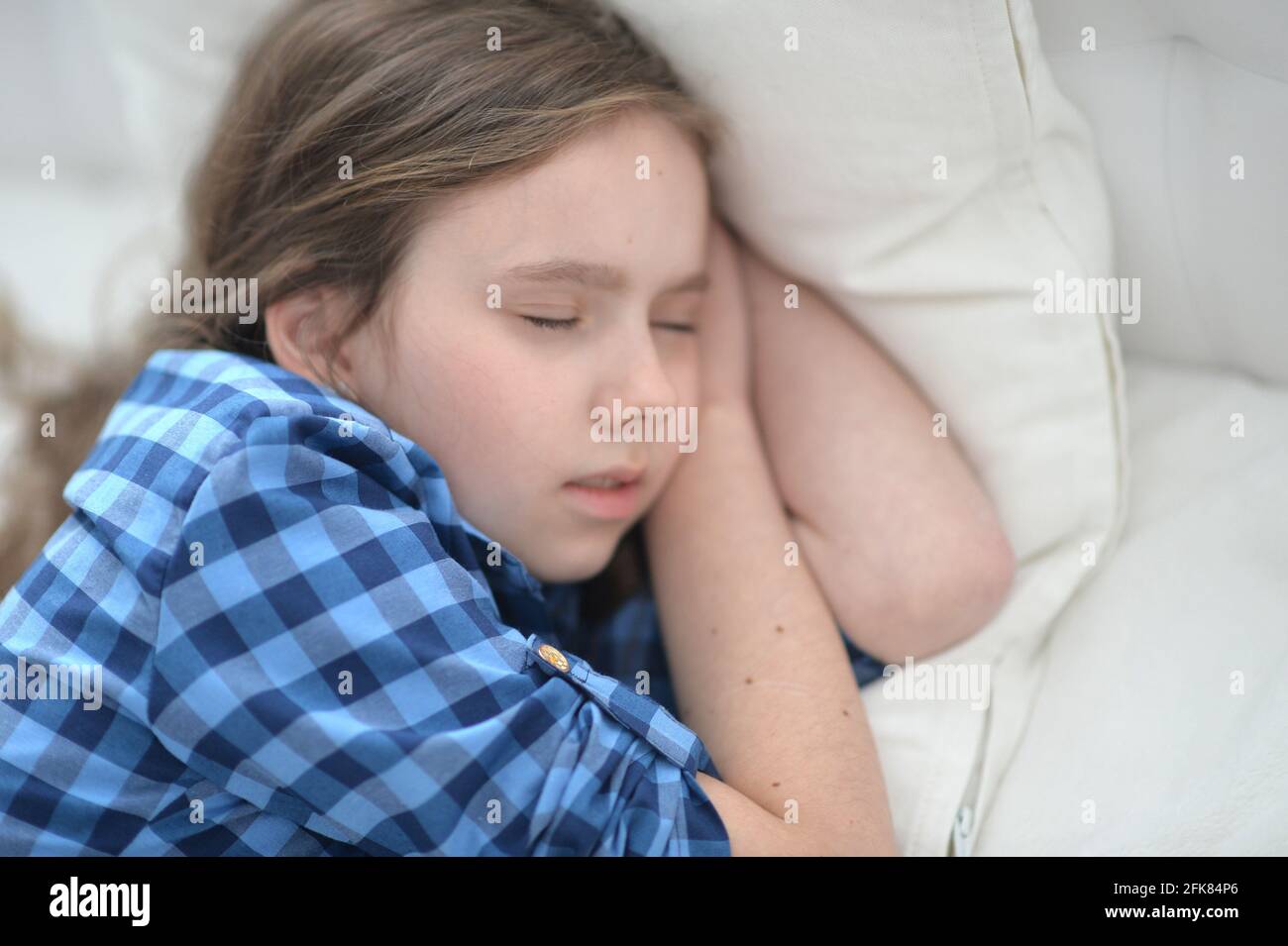 Cute little girl sleeping in bed at home Stock Photo Alamy