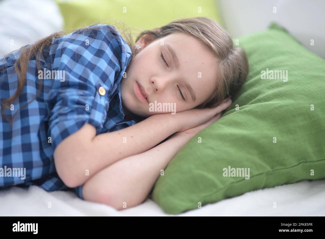 Cute little girl sleeping in bed at home Stock Photo Alamy