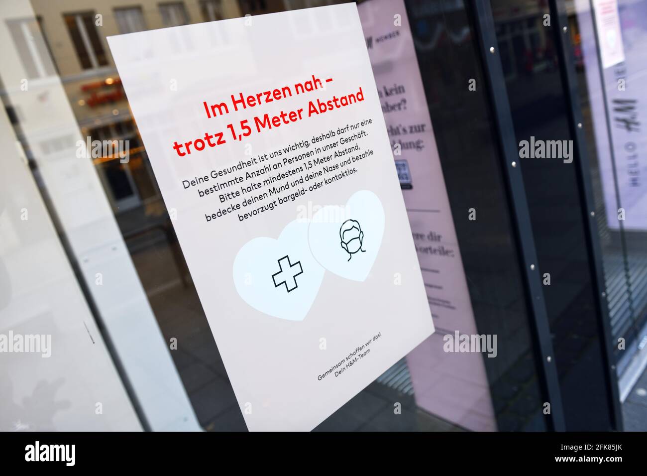 Corona Rules Notice On A Shop Window In Hamburg, Germany Stock Photo