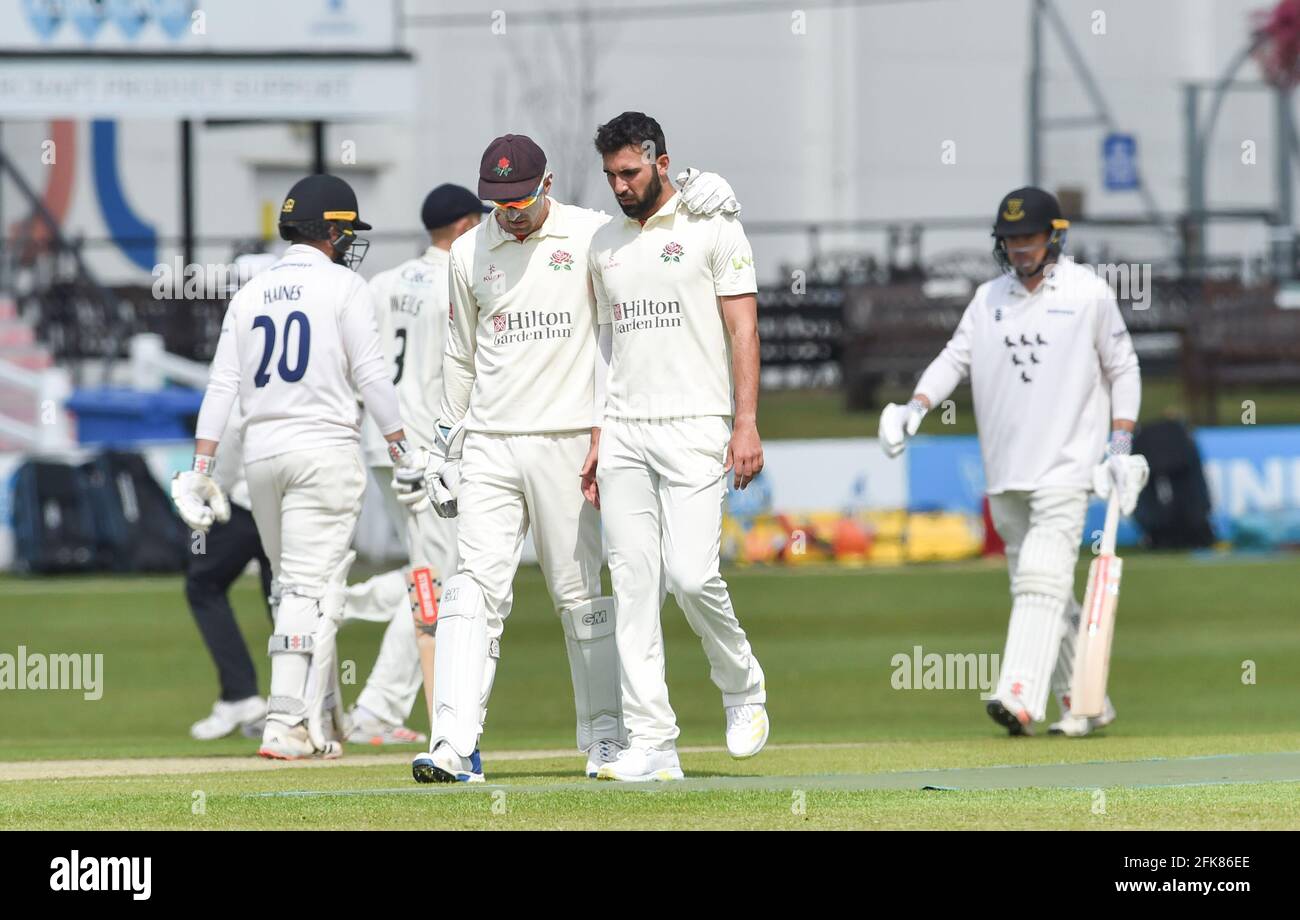 Hove UK 29th April 2021 - Lancashire bowler Saqib Mahmood gets a comforting arm around his shoulder from Dane Vilas after a missed chance against Sussex on the first day of their LV= Insurance County Championship match at The 1st Central County Ground  in Hove . : Credit Simon Dack / Alamy Live News Stock Photo