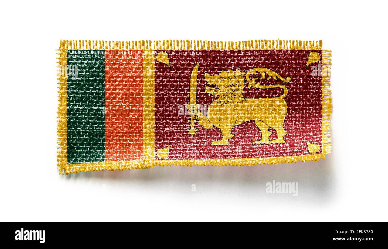 Sri Lanka flag on a piece of cloth on a white background Stock Photo