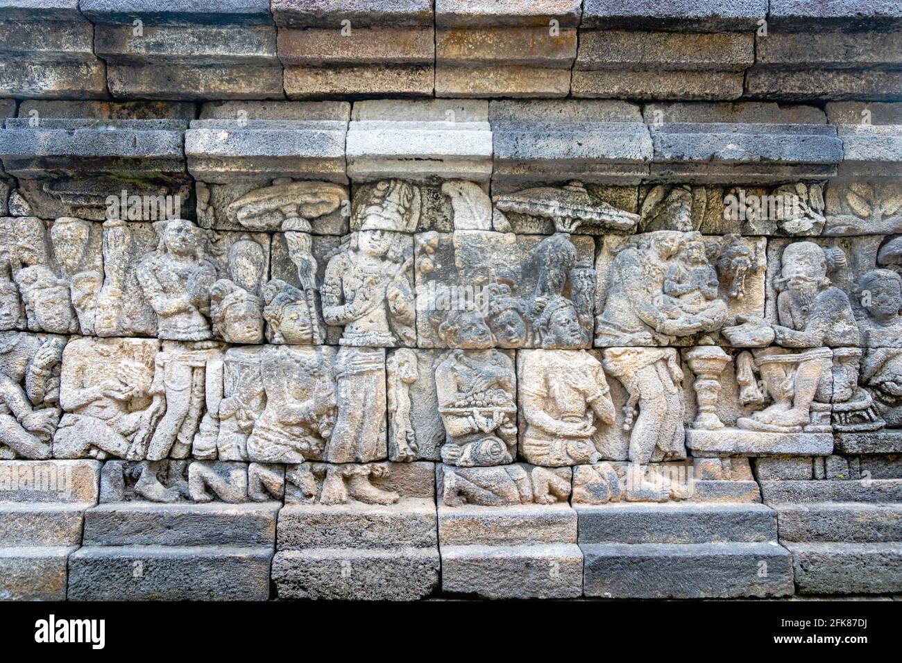 Carved relief at Borobudur on Java Indonesia. Borobudur is a Buddhist ...
