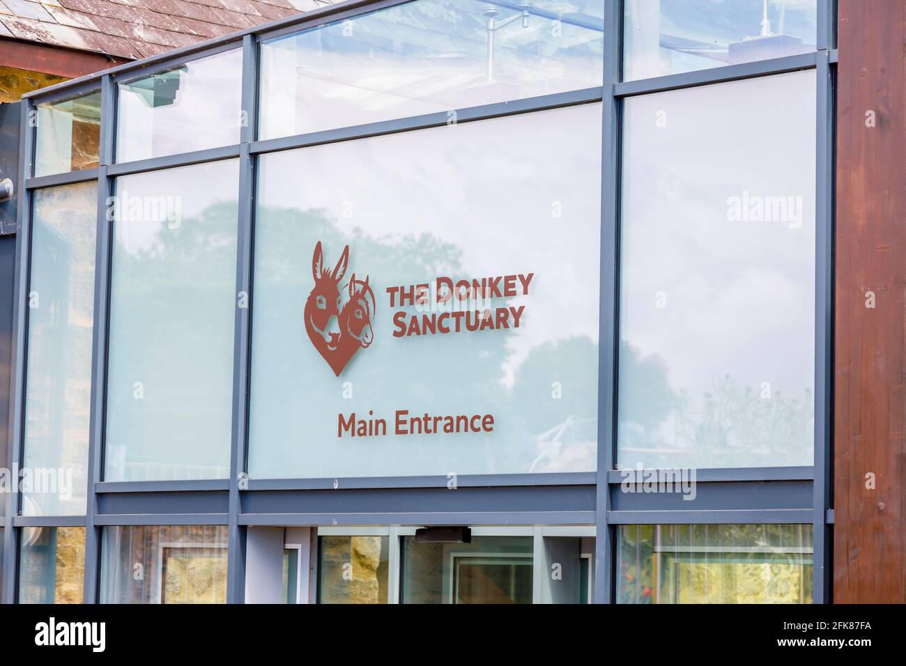 Main entrance to The Donkey Sanctuary for retired donkeys, Sidmouth, Devon in south coast West Country, England, a popular family tourist attraction Stock Photo