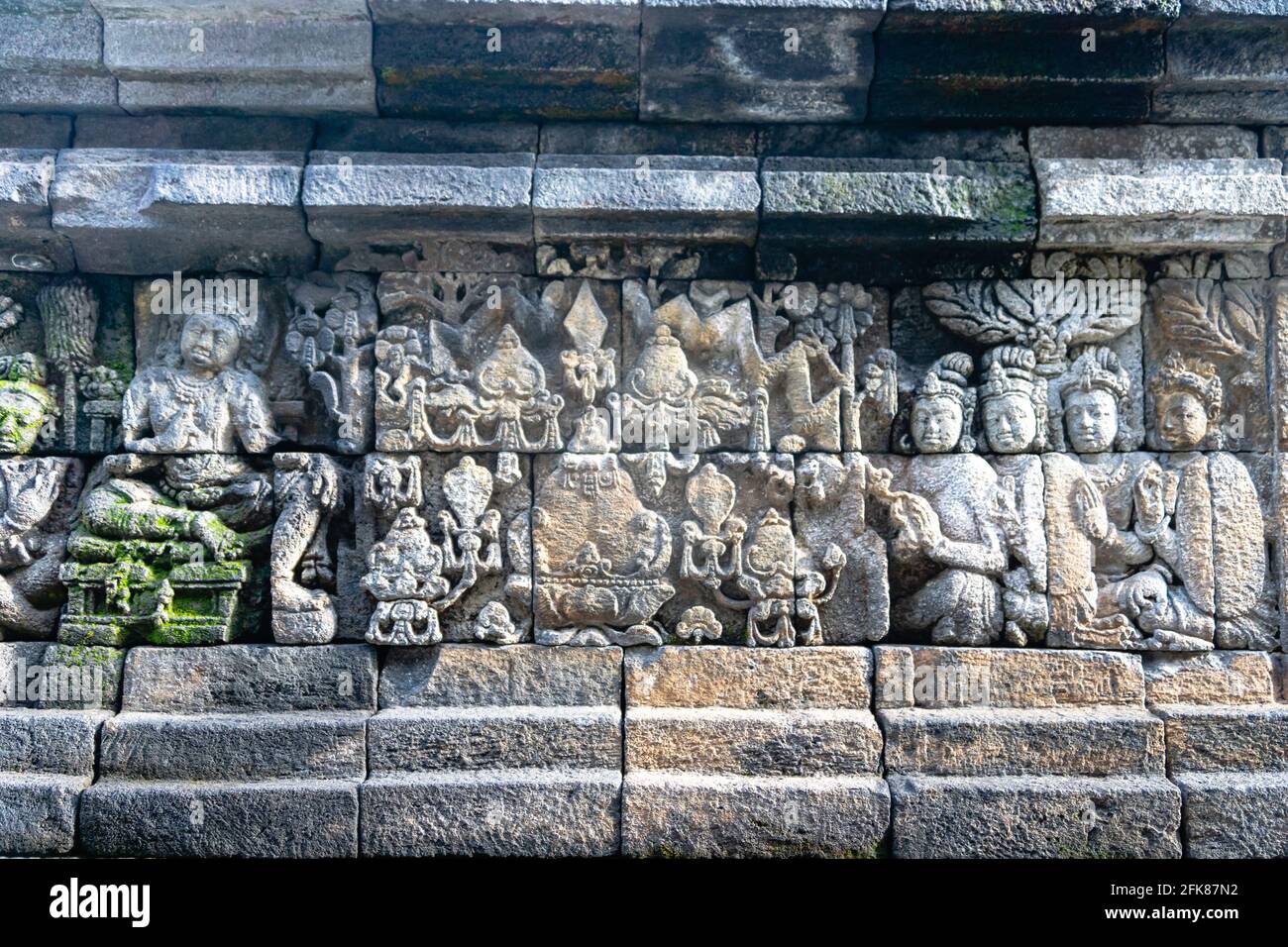 Carved relief at Borobudur on Java Indonesia. Borobudur is a Buddhist ...