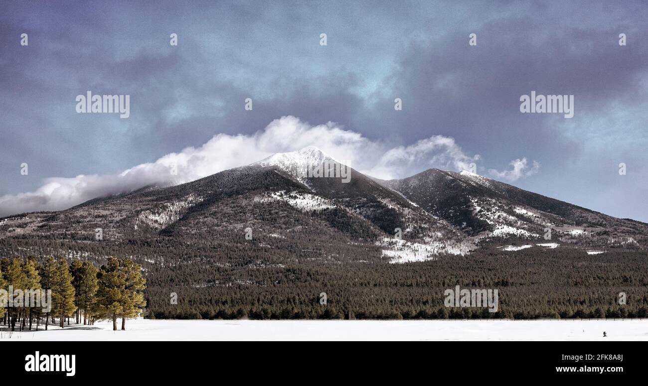 The San Francisco peaks north of Flagstaff, Arizona rise to 13,000 feet and are often covered in snow. Stock Photo