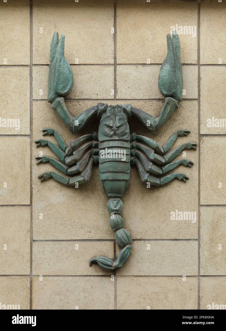 Scorpio. Zodiac sign depicted in the ceramic relief on the dwelling house in Sokolovská Street in Libeň district in Prague, Czech Republic. Stock Photo