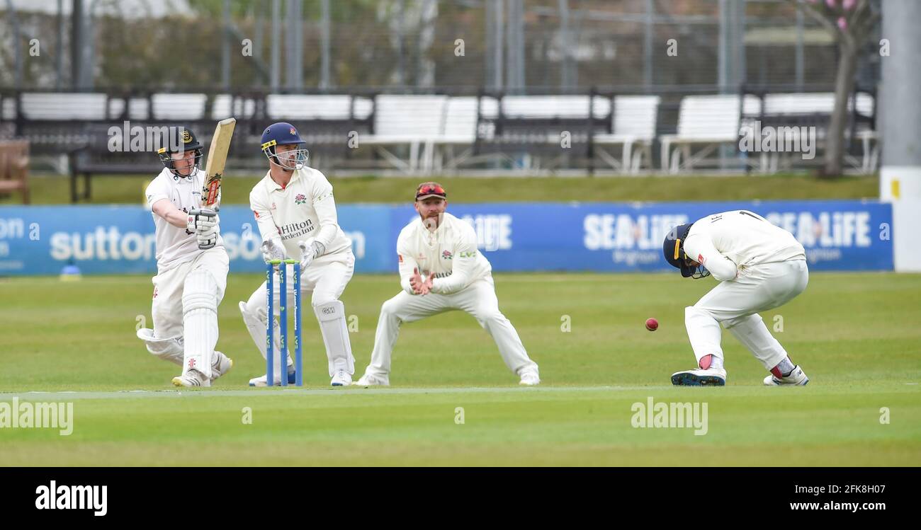 Hove UK 29th April 2021 - Ben Brown batting for Sussex has. Lancashire's close fielder Keaton Jennings taking evasive action  on the first day of their LV= Insurance County Championship match at The 1st Central County Ground  in Hove . : Credit Simon Dack / Alamy Live News Stock Photo