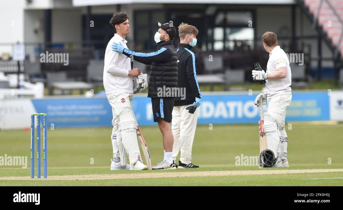 Hove UK 29th April 2021 - Tom Clark of Sussex is checked over after being  struck on the helmet against Lancashire on the first day of their LV=  Insurance County Championship match