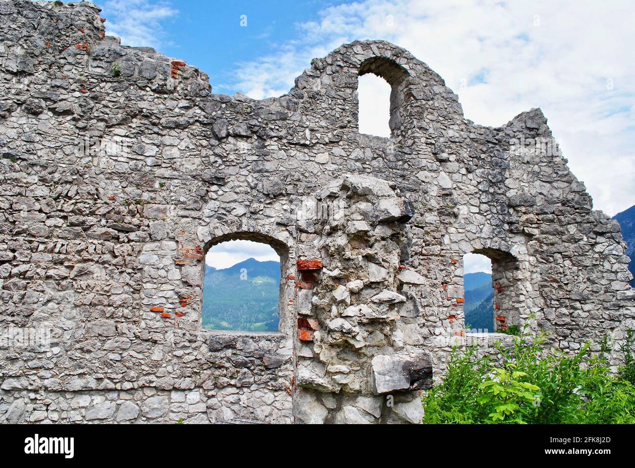 Ehrenberg Castle ruins (Burgruine Ehrenberg) in Reutte, Austria. A historic medieval castle, with defensive walls, tall towers. Gothic stone walls. Stock Photo