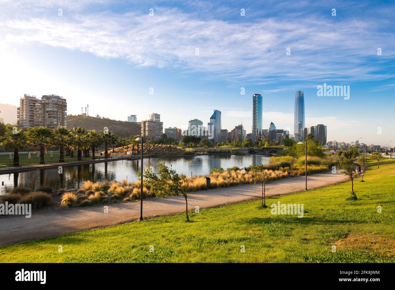 Skyline of buildings at Las Condes and Providencia districts and the pond at Bicentennial Park in Vitacura, Santiago de Chile Stock Photo