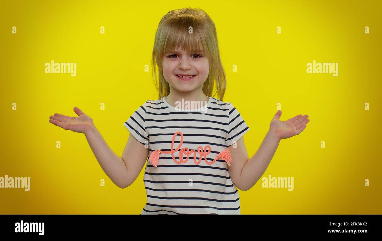 Indignant Children Confused blonde child girl raising hands in indignant expression ...