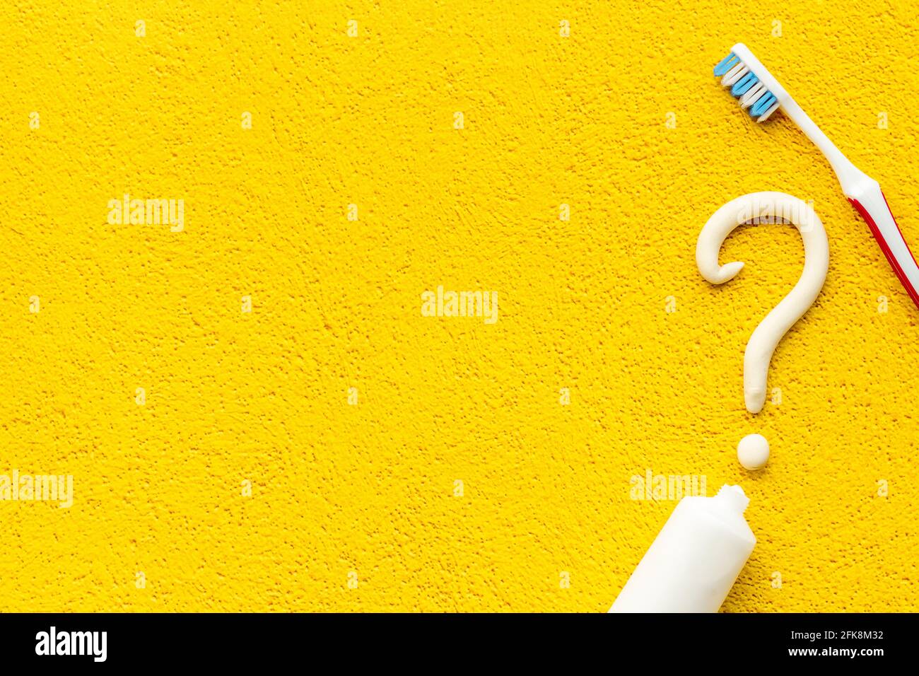 Question Mark With Toothpaste Question mark of toothpaste with toothbrush, top view. Oral care and ...