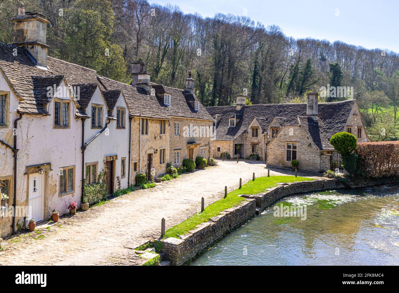 Cottages beside the By Brook in the Cotswold village of Castle Combe, Wiltshire UK Stock Photo