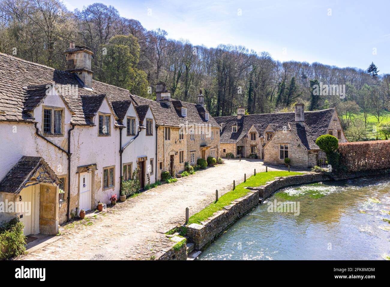 Cottages beside the By Brook in the Cotswold village of Castle Combe, Wiltshire UK Stock Photo