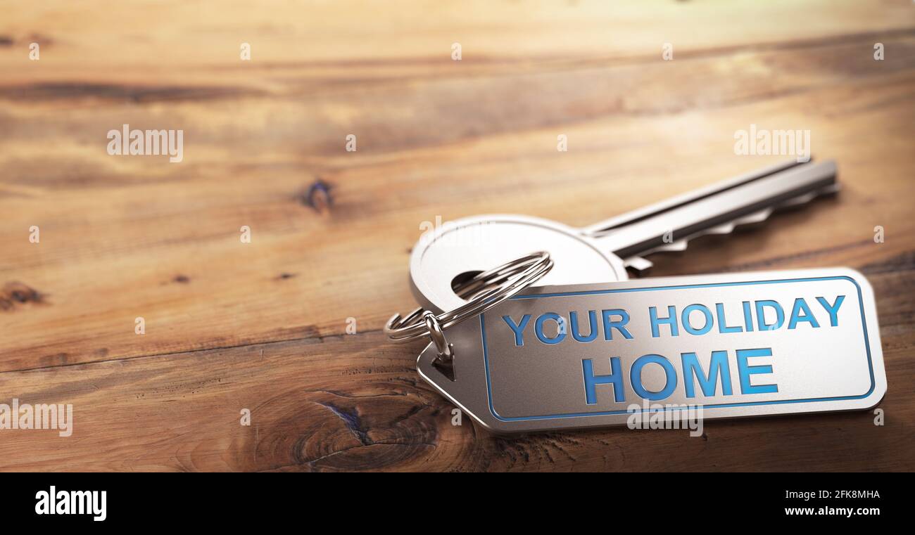 3D illustration of a keychain with the slogan your holiday home engraved on it. Wooden background with copy space. Accomodations rental concept. Stock Photo