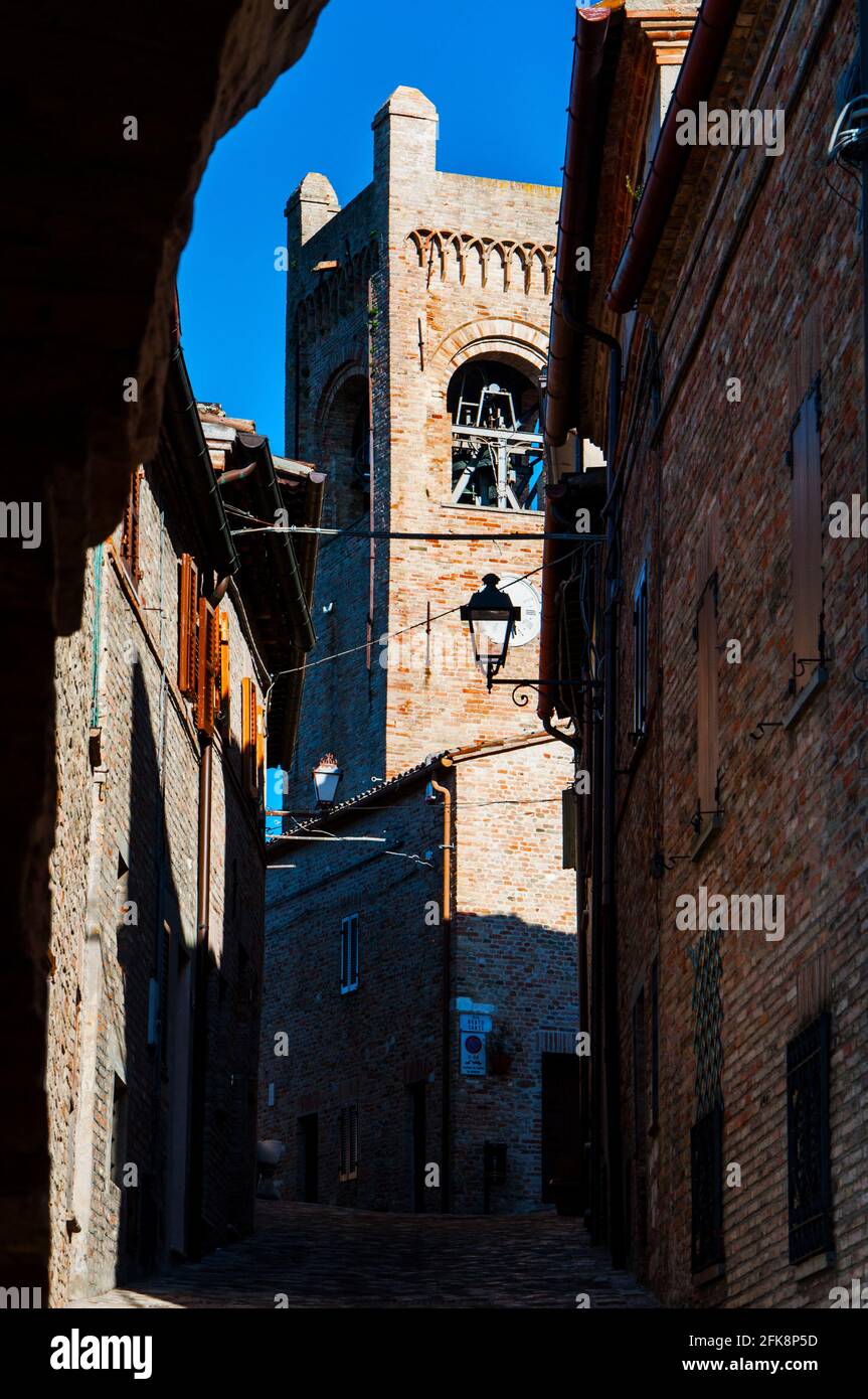 Vertical shot of a narrow street between old buildings and towers Stock ...