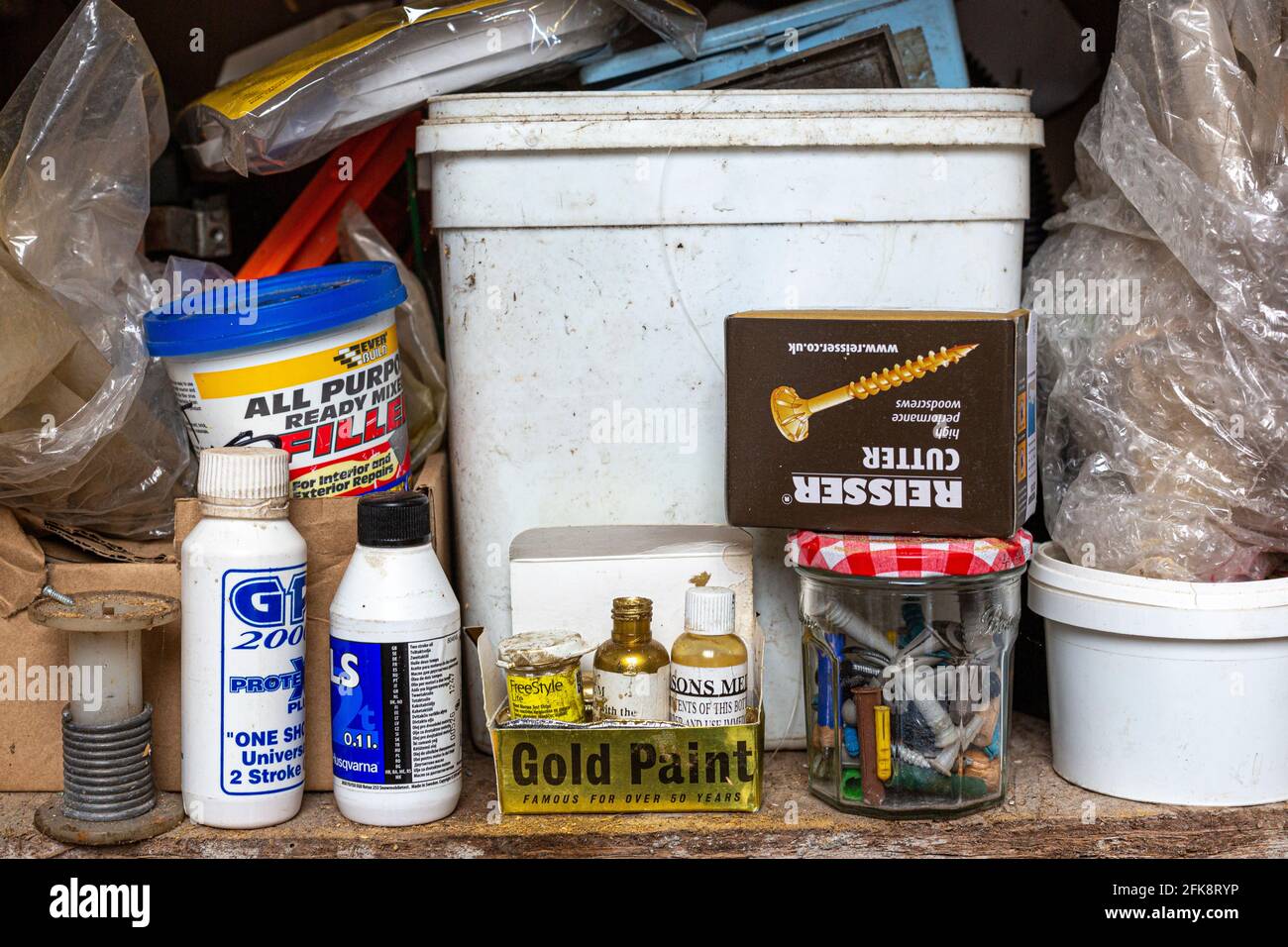 Old plastic tubs and containers on a shed shelf Stock Photo Alamy